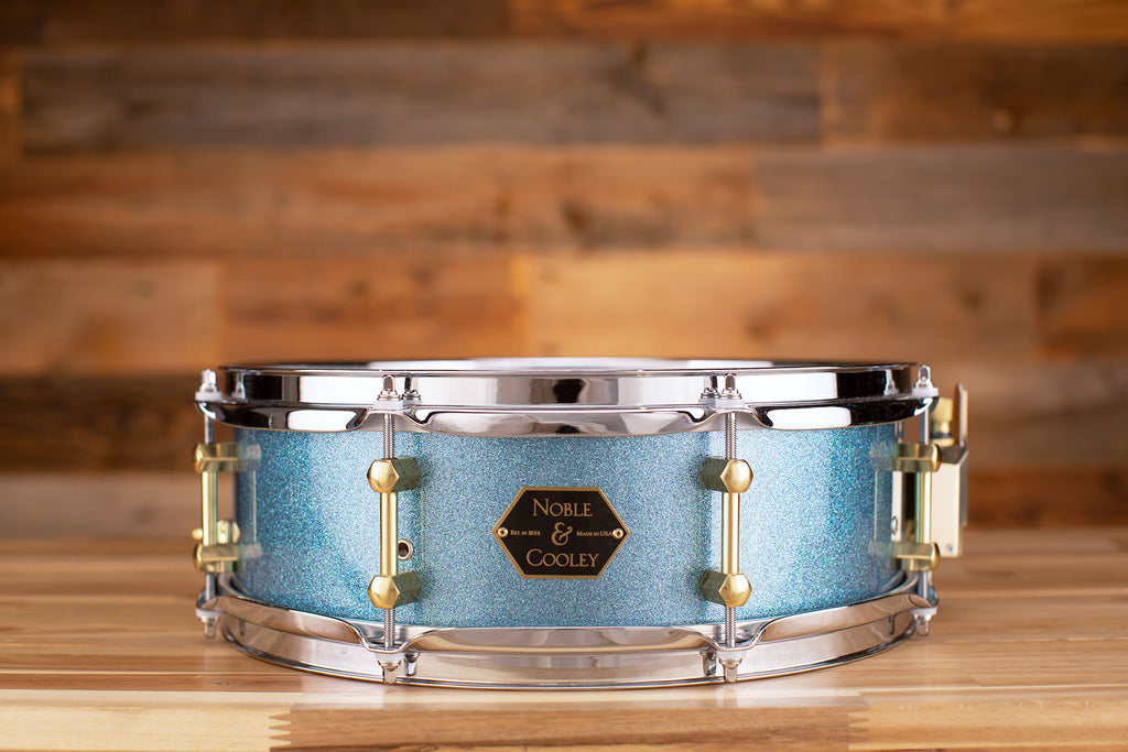 NOBLE & COOLEY 14 X 4.75 WALNUT PLY SNARE DRUM AQUA SPARKLE